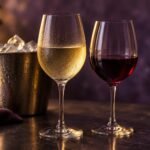 Chilled white wine and red wine glasses beside an ice bucket, illustrating wine serving temperature