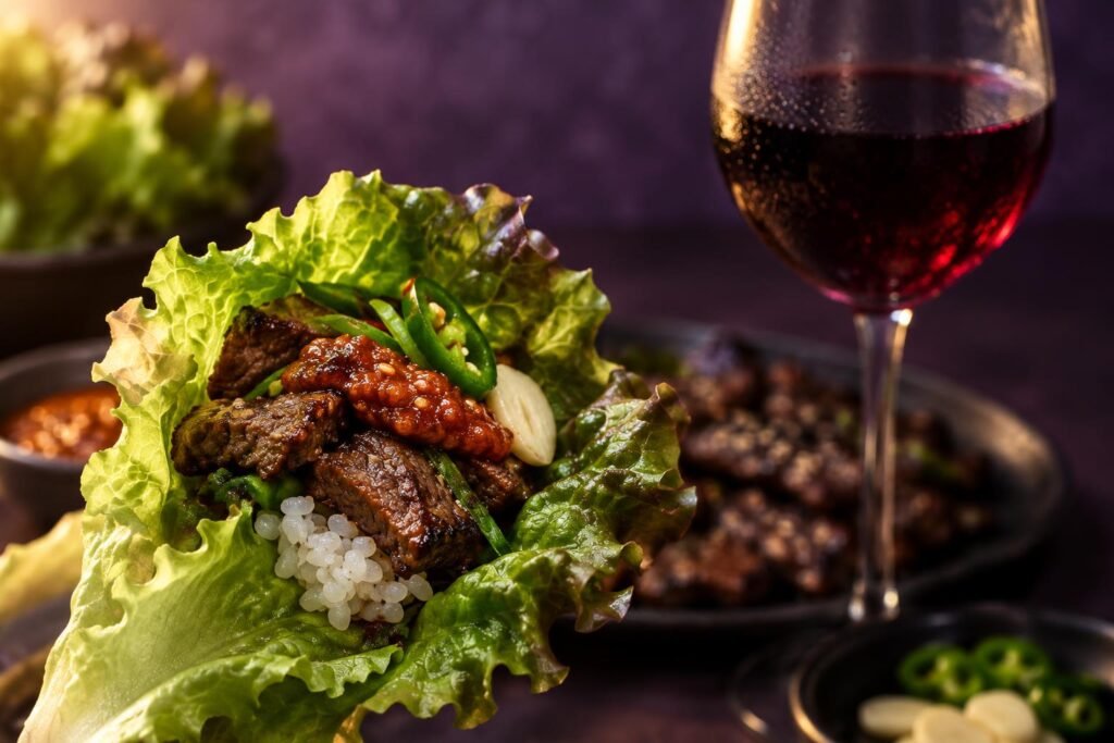 Best Wine With Korean BBQ: Sweet, Spicy and Smoky Pairings 2 Lettuce wrap with grilled beef and a glass of red wine